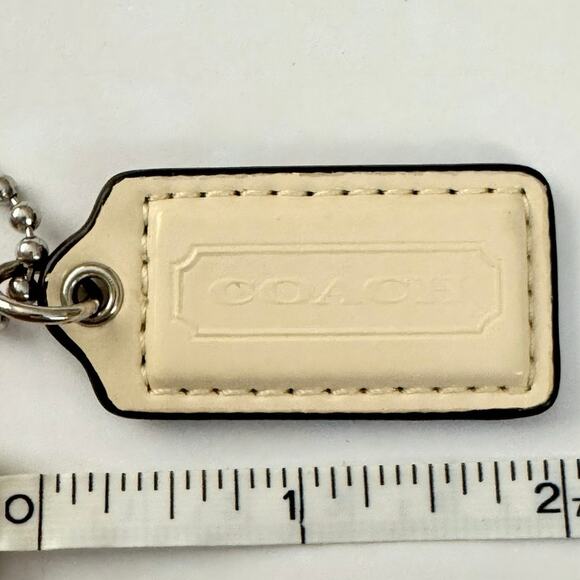 Coach ivory patent leather key fob bag charm hangtag silver-tone hardware 2” - Picture 3 of 5